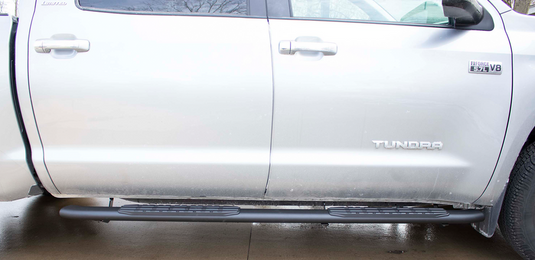 Alt text: "Silver Toyota Tundra Double Cab fitted with Fishbone Offroad 5 Inch Oval Side Steps"