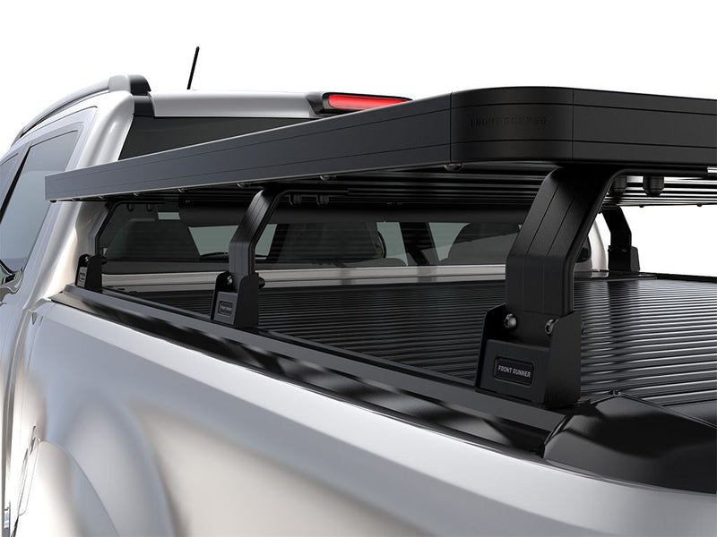 Load image into Gallery viewer, Front Runner Ford F-150 Retrax XR 5&#39;6 Slimline II Load Bed Rack Kit installed on a pickup truck, showcasing the sturdy rack structure and sleek design.
