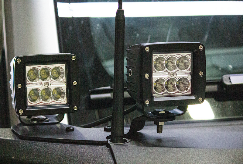 Load image into Gallery viewer, Fishbone Offroad cowl pod light bracket set for 2022-Current Ford Bronco, LED lights mounted on vehicle.
