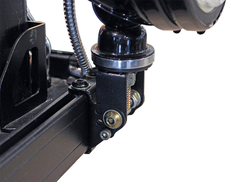 Load image into Gallery viewer, Close-up of Front Runner Roof Rack Spotlight Bracket mounted on vehicle rack with wiring and adjustable bolt features
