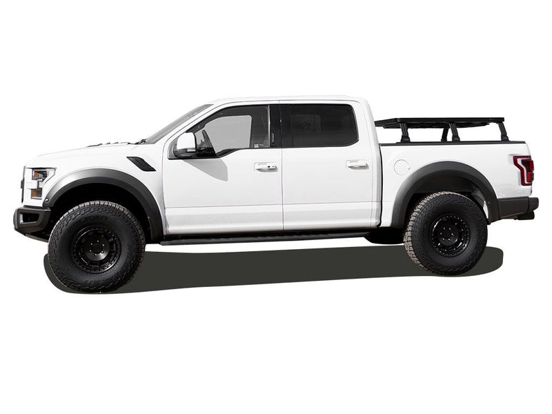 Load image into Gallery viewer, Ford F150 equipped with Front Runner Slimline II Load Bed Rack Kit, showing the roll top 6.5&#39; bed rack on the 2015-current model.
