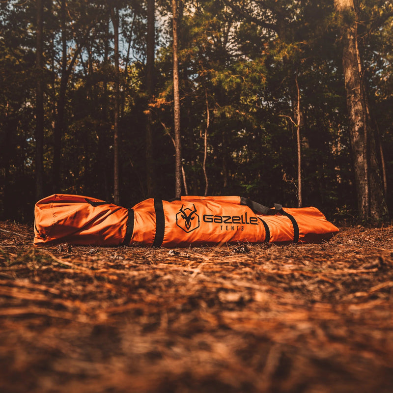 Load image into Gallery viewer, Gazelle Tents T4 Hub Tent packed in carrying bag on forest floor at dusk.
