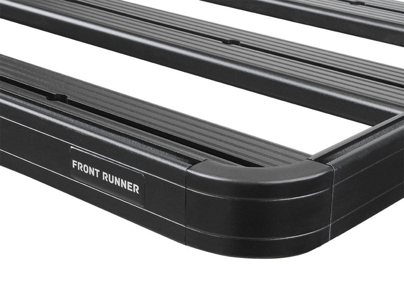 Load image into Gallery viewer, Close-up of the black Front Runner Slimline II Roof Rack for RAM 1500/2500/3500 Crew Cab models from 2009 to Current with visible brand logo.
