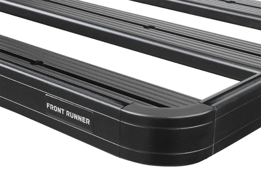 Close-up of the black Front Runner Slimline II Roof Rack for RAM 1500/2500/3500 Crew Cab models from 2009 to Current with visible brand logo.