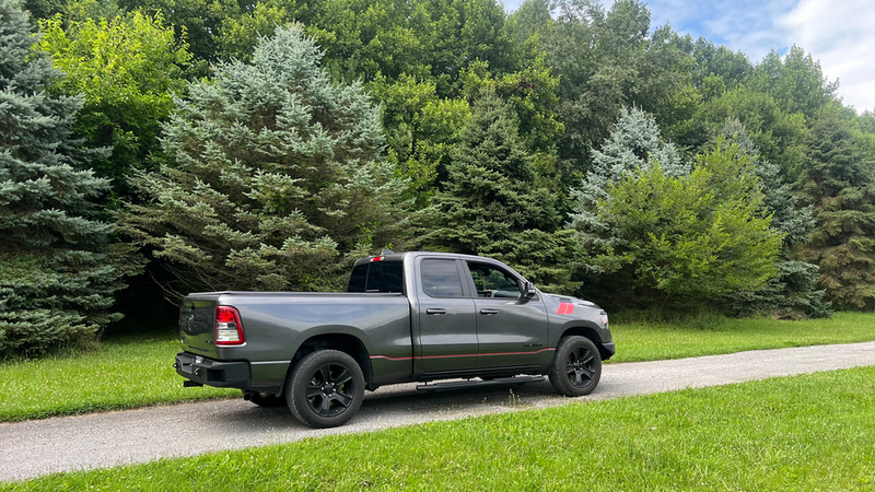 Load image into Gallery viewer, Alt text: &quot;2019 Ram 1500 equipped with Fishbone Offroad Pike Rear Bumper, showcased outdoors with trees in the background.&quot;
