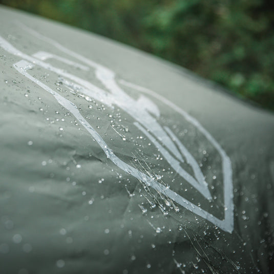 Close-up of Gazelle Tents T4 Hub Tent material with water droplets, highlighting waterproof outdoor camping gear.