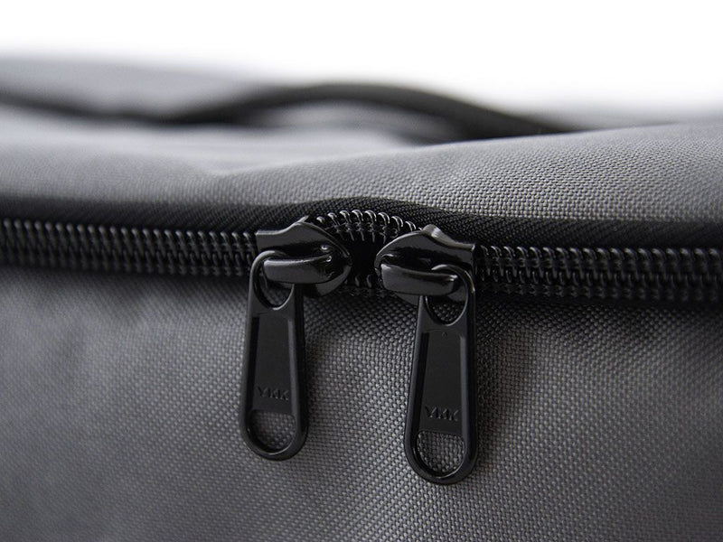 Load image into Gallery viewer, Close-up of durable YKK zippers on the Front Runner Flat Pack storage bag.
