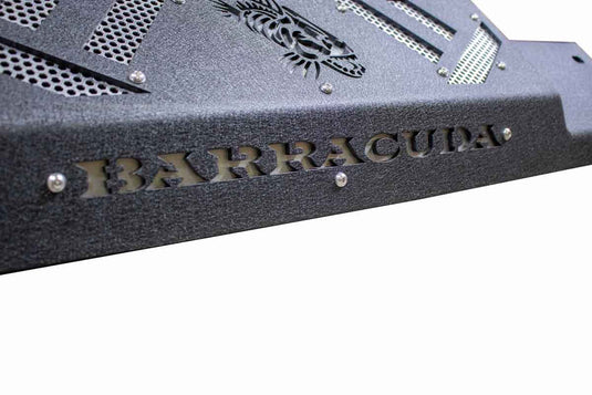 Alt text: "Close-up of a Fishbone Offroad Barracuda Modular Bumper for 2007-Current Jeep Wrangler JK, JKU, JL, JLU & Gladiator JT, featuring textured black finish and cut-out 'BARRACUDA' branding."