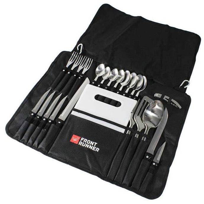 Front Runner Camp Kitchen Utensil Set displayed open with various cooking tools such as knives, forks, spoons, and spatula, neatly organized in a portable black roll-up pouch.