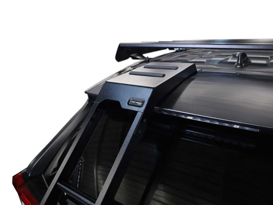 "Front Runner ladder attached to the rear of a Toyota RAV4 2019 model, showcasing compatibility and sleek design."