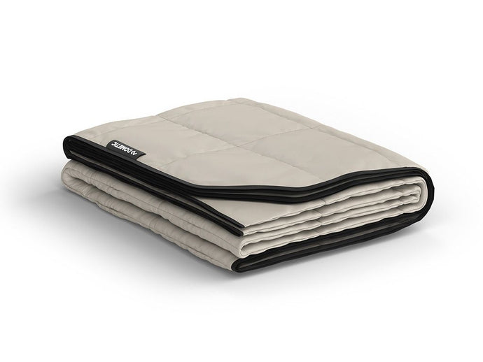Alt text: inchFolded Front Runner Dometic Go Camp Blanket in Ash color on a white background.inch
