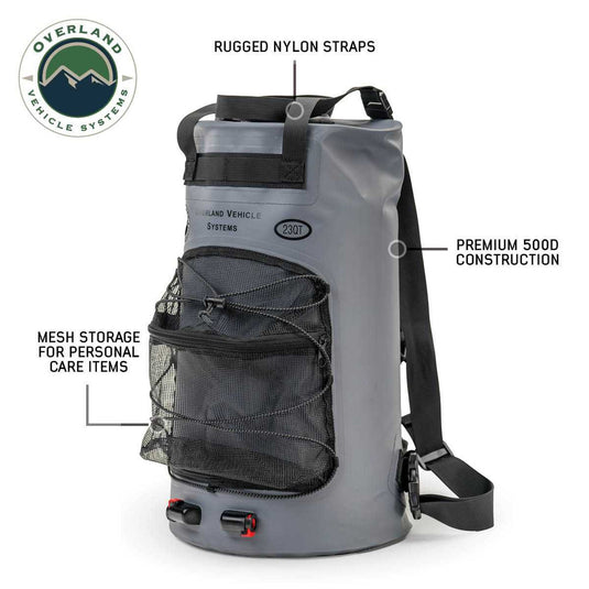 Alt text: "Overland Vehicle Systems portable camp shower 23 QT with durable nylon straps, premium 500D construction, and mesh storage for personal care items."