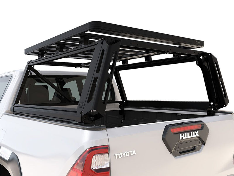 Load image into Gallery viewer, Alt text: &quot;Front Runner Toyota Hilux Revo Double Cab 2016-Current Pro Bed Rack Kit installed on pickup truck for increased cargo capacity.&quot;
