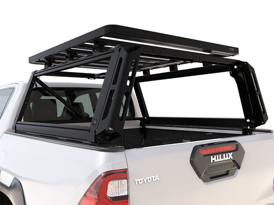 Alt text: "Front Runner Toyota Hilux Revo Double Cab 2016-Current Pro Bed Rack Kit installed on pickup truck for increased cargo capacity."