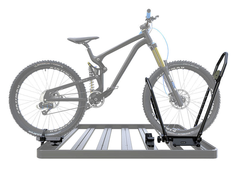 Load image into Gallery viewer, Front Runner Pro Bike Carrier with a mountain bike securely mounted on a vehicle roof rack system.
