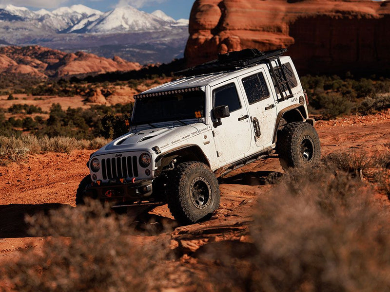 Load image into Gallery viewer, &quot;White Jeep Wrangler JK equipped with Front Runner side mount ladder, off-roading in a mountainous desert landscape&quot;
