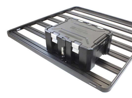 Front Runner Wolf Pack Pro storage box securely mounted on roof rack with durable mounting brackets