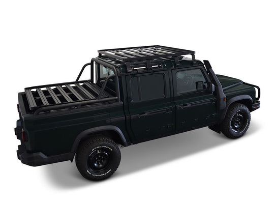 Alt text: "Ineos Grenadier vehicle equipped with Front Runner Slimline II Roof Rack Kit, showcasing the 2023 Quartermaster edition accessory for off-road and utility use."