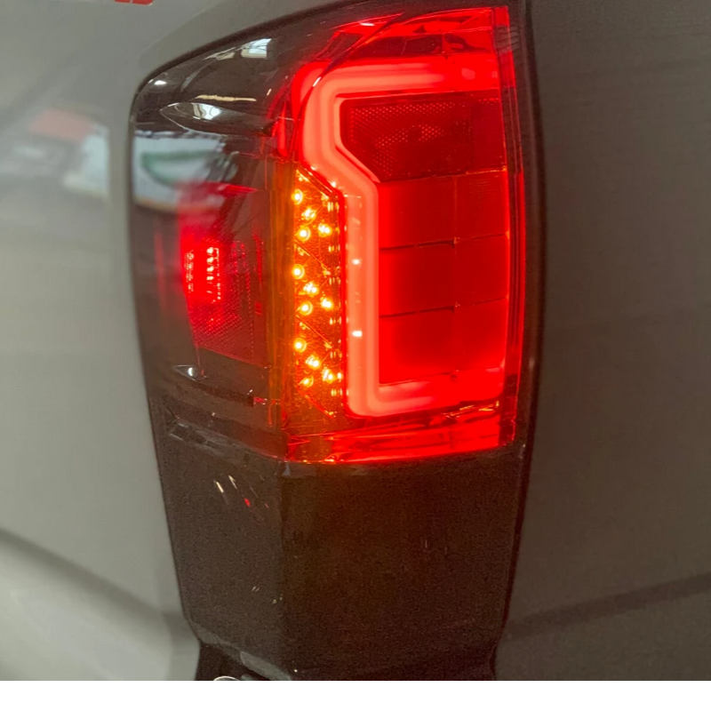 Load image into Gallery viewer, Cali Raised LED 2016-2020 Toyota Tacoma Raptor Style Tail Lights *Sold as Pair*
