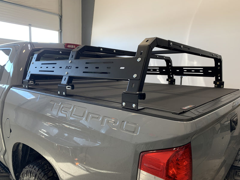 Load image into Gallery viewer, RCI Off Road Adjustable Bed Rack with Tonneu Adapters BAKflip Revolver

