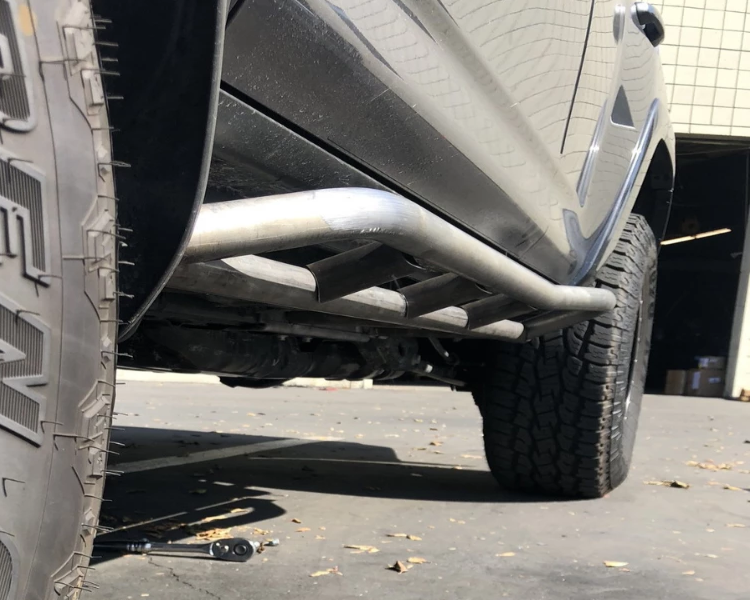 Load image into Gallery viewer, Cali Raised LED 2010-2021 Toyota 4Runner Trail Edition Bolt On Rock Sliders
