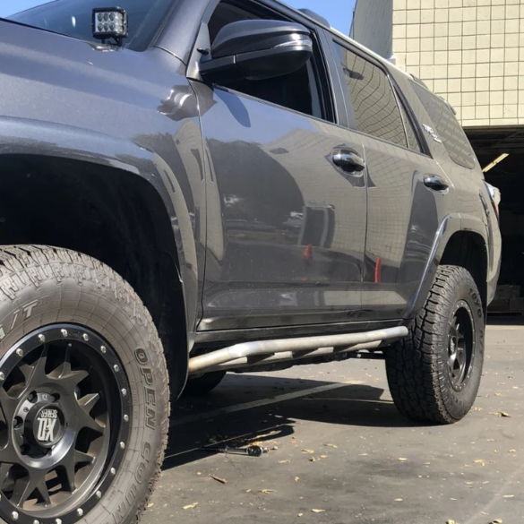 Load image into Gallery viewer, Cali Raised LED 2010-2022 Toyota 4Runner Trail Edition Bolt On Rock Sliders
