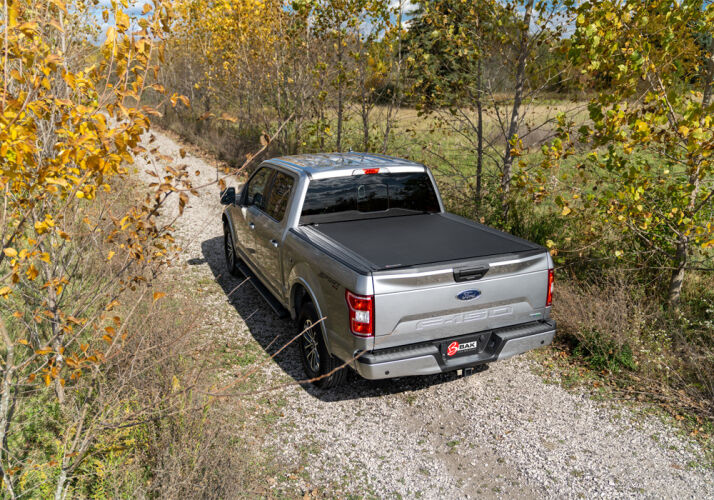 Load image into Gallery viewer, BAKFlip Revolver X4s Truck Bed Cover 2005-2021 Nissan Frontier w/ Factory Bed Rail Caps
